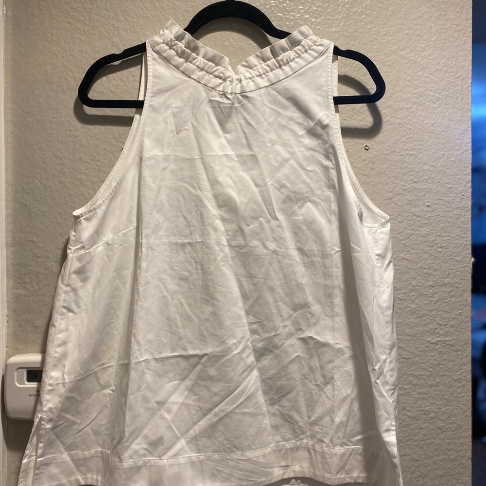 Ann Taylor White Cotton top with ruffle neck.
